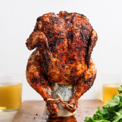 Cooked beer can chicken standing on can