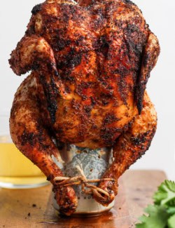 Cooked beer can chicken standing on can