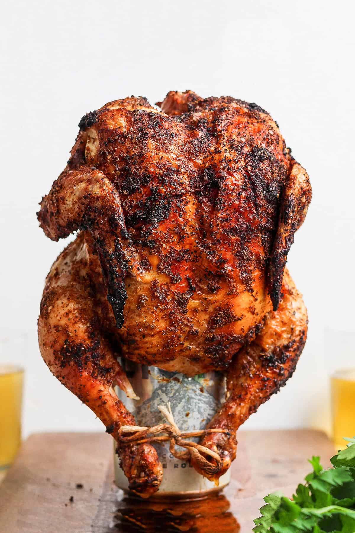 Cooked beer can chicken standing on can