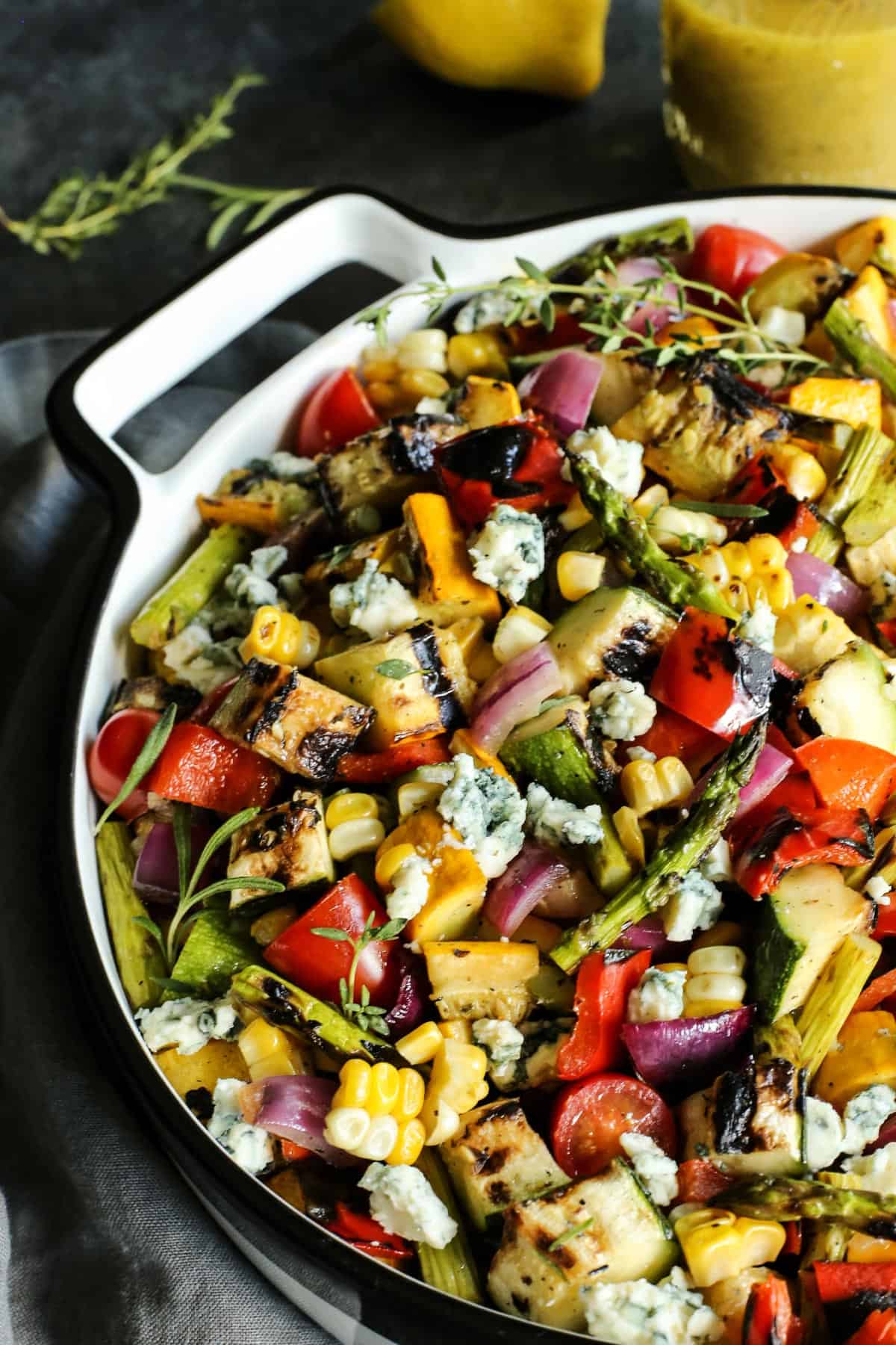 large white dish with salad of grilled vegetables