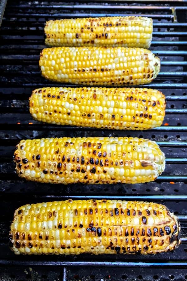 cobs of sweet corn on the grill