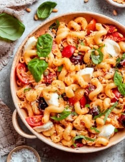 Serving bowl of sun-dried tomato pasta salad.