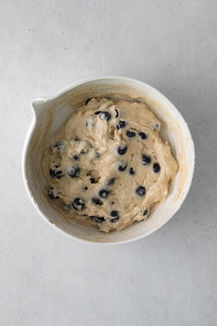 Blueberry muffin batter in a mixing dish