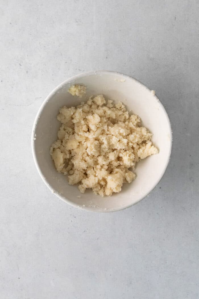 Sugar crumble topping in a white dish