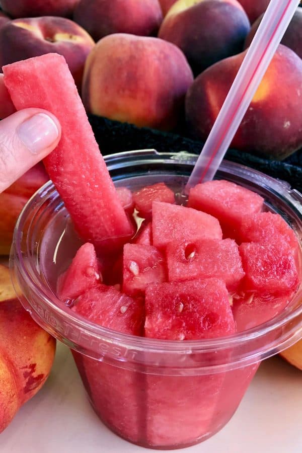 watermelon sticks in a glass of kombucha