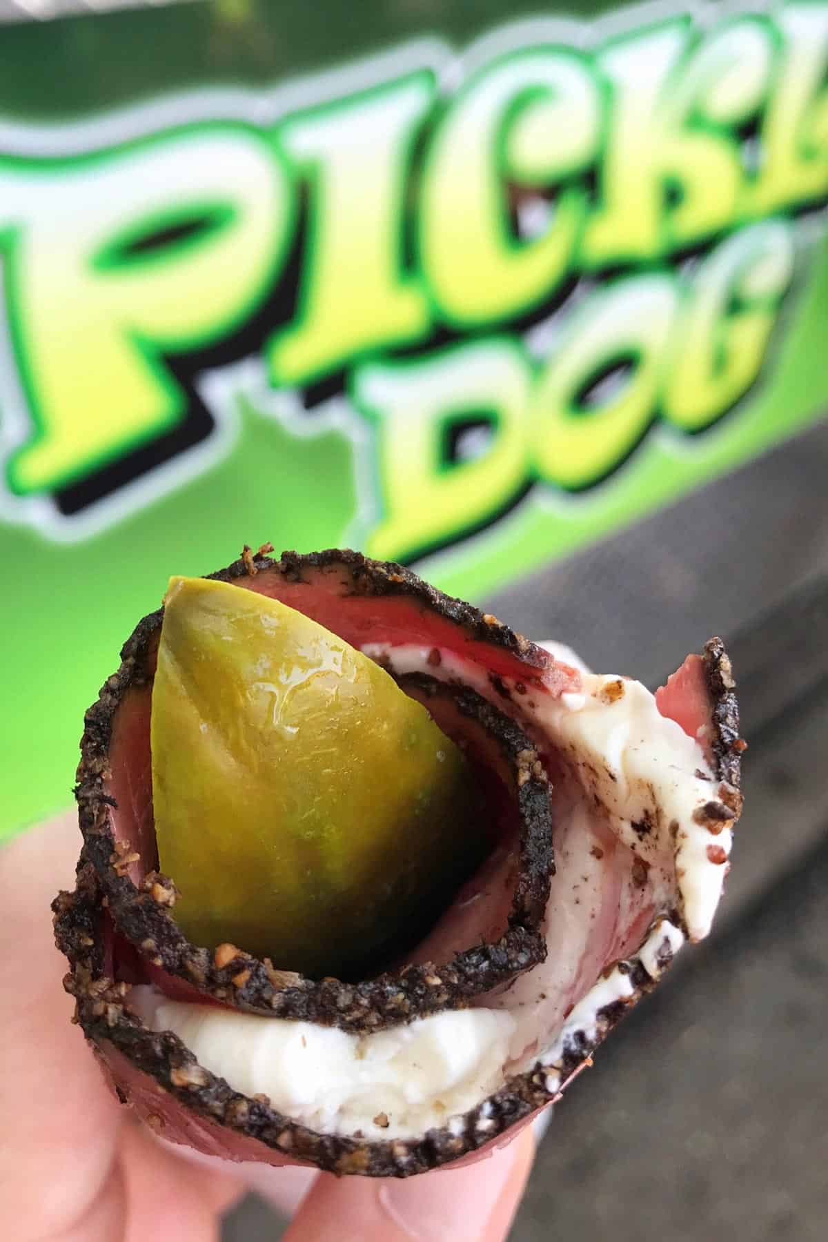 pickle spear wrapped in pastrami and cream cheese