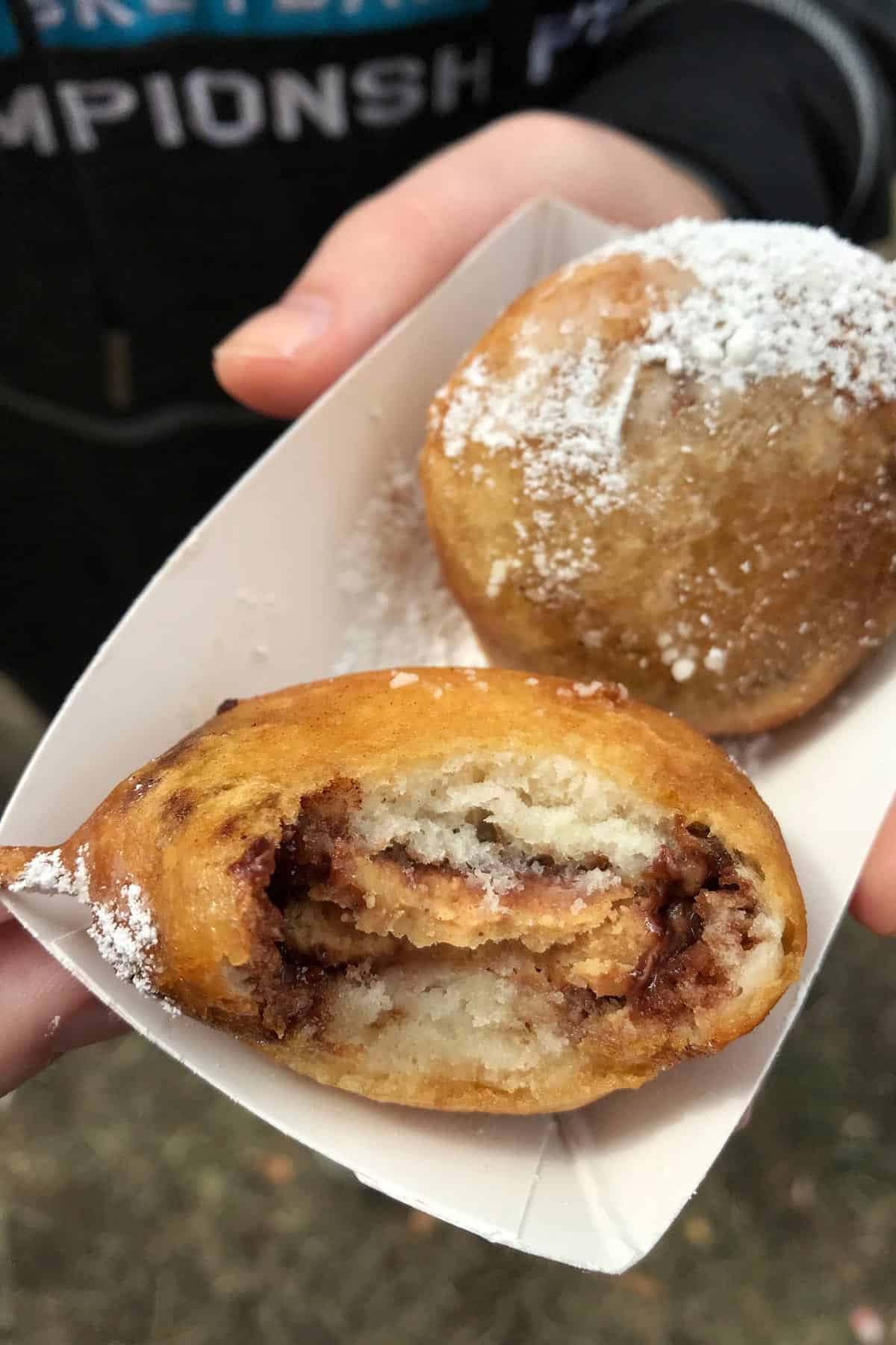 2 deep fried Reeses sprinkled with powdered sugar