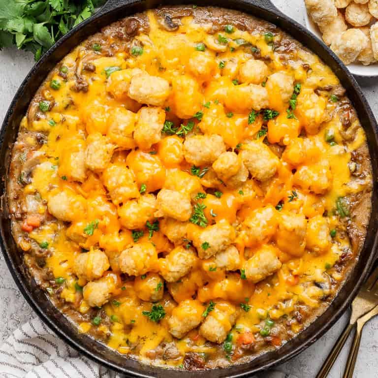 Overhead view of tater tot hotdish in cast iron skillet