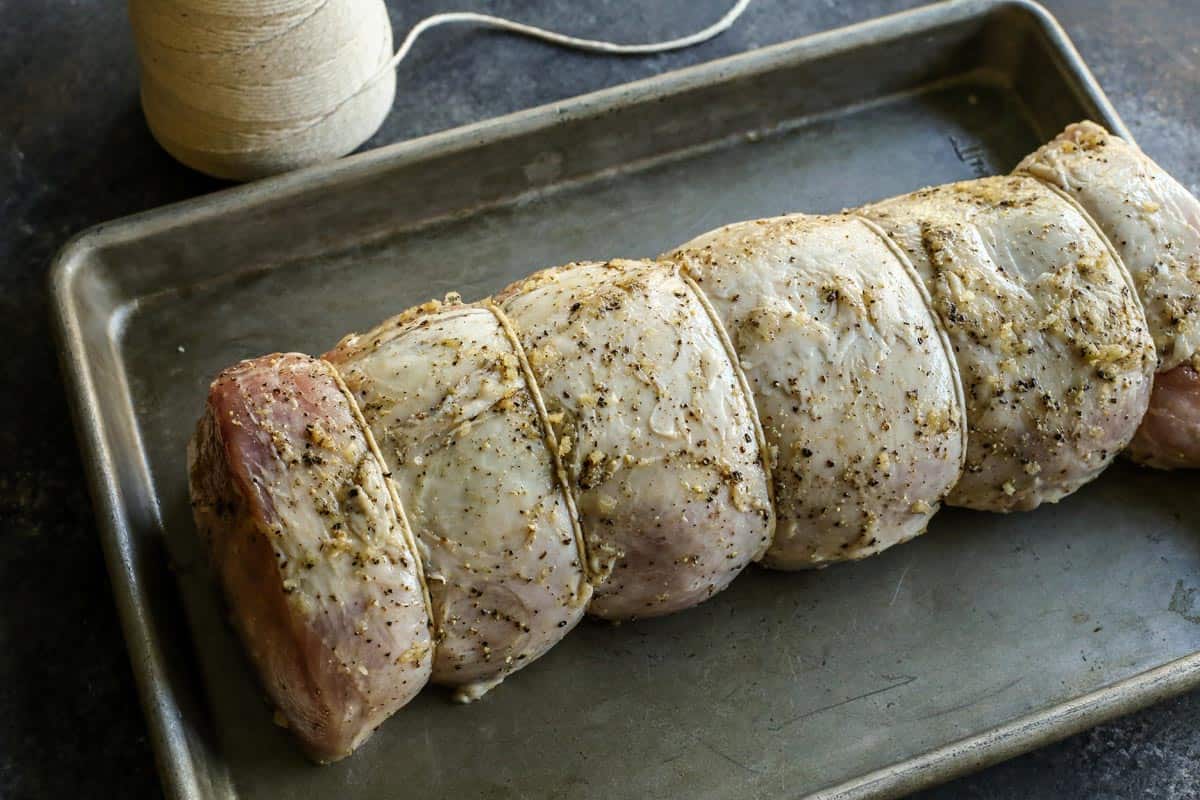 A pork loin roast tied with string