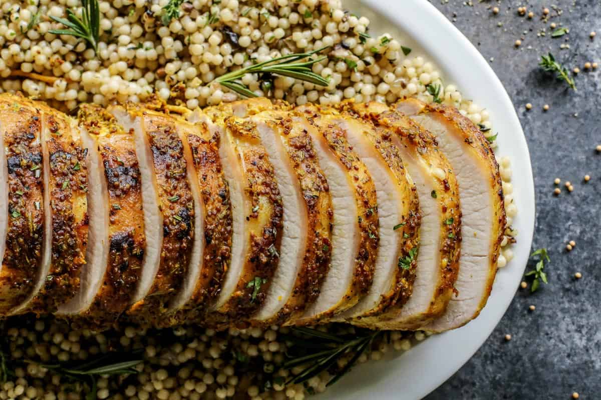 sliced Mustard Pork Loin Roast on couscous