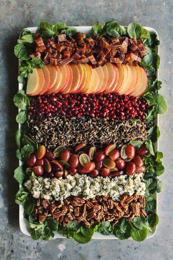 Holiday Wild Rice Salad from afarmgirlsdabbles.com - This beautiful deconstructed salad consists of wild rice, bacon, pecans, apples, pomegranate seeds, grapes, and blue cheese. And it's paired with an easy-to-make maple Dijon dressing. It's hearty and nourishing. You're going to want this salad all winter long! #salad #wildrice #rice #bacon #pomegranate #pecans #grapes #bluecheese #cheese #maple #mustard Holiday Wild Rice Salad from afarmgirlsdabbles.com - This beautiful deconstructed salad consists of wild rice, bacon, pecans, apples, pomegranate seeds, grapes, and blue cheese. And it's paired with an easy-to-make maple Dijon dressing. It's hearty and nourishing. You're going to want this salad all winter long! #salad #wildrice #rice #bacon #pomegranate #pecans #grapes #bluecheese #cheese #maple #mustard
