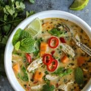 Overhead view of Thai Chicken Soup in a white bowl.