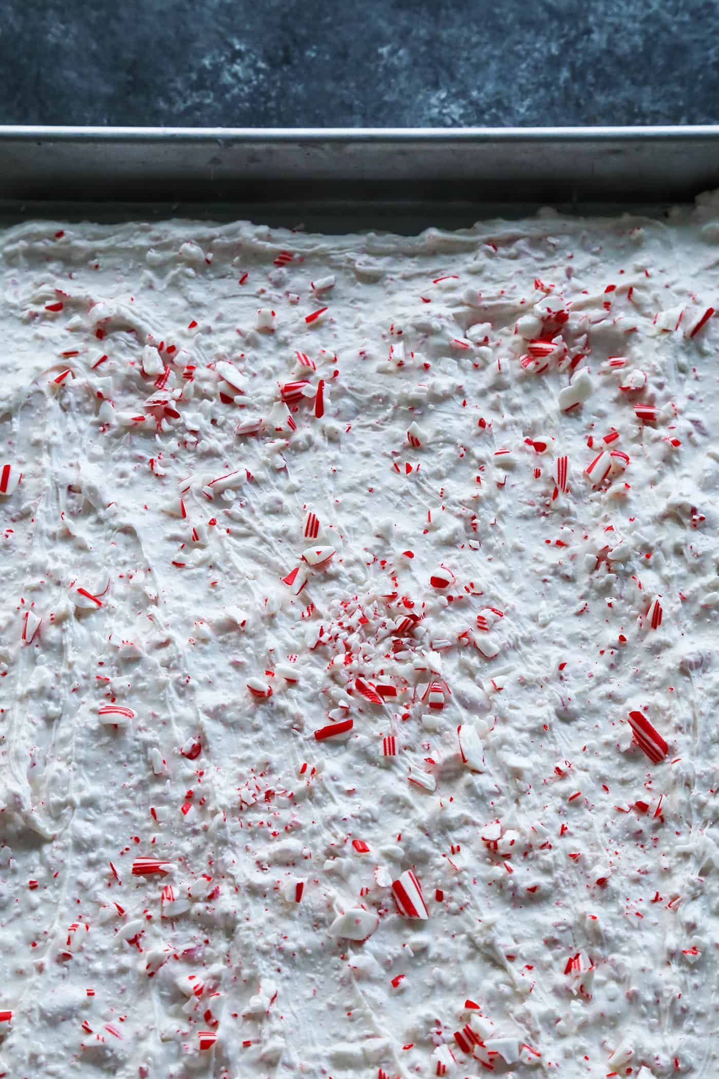 Candy cane bark in a baking sheet.