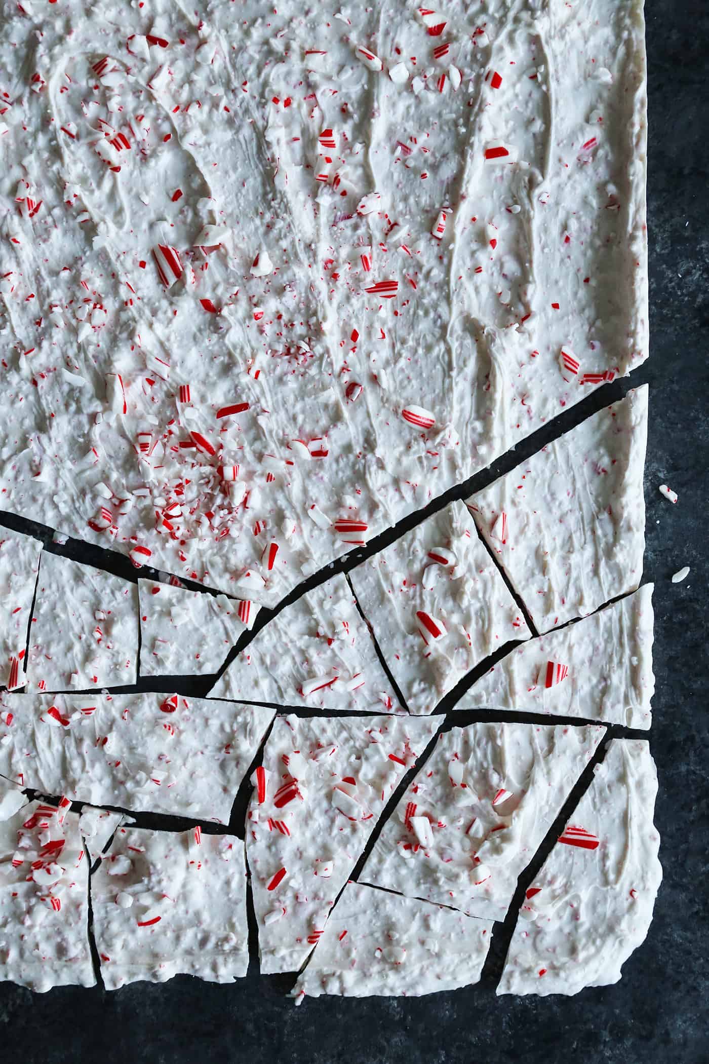 A baking sheet of peppermint bark half cracked