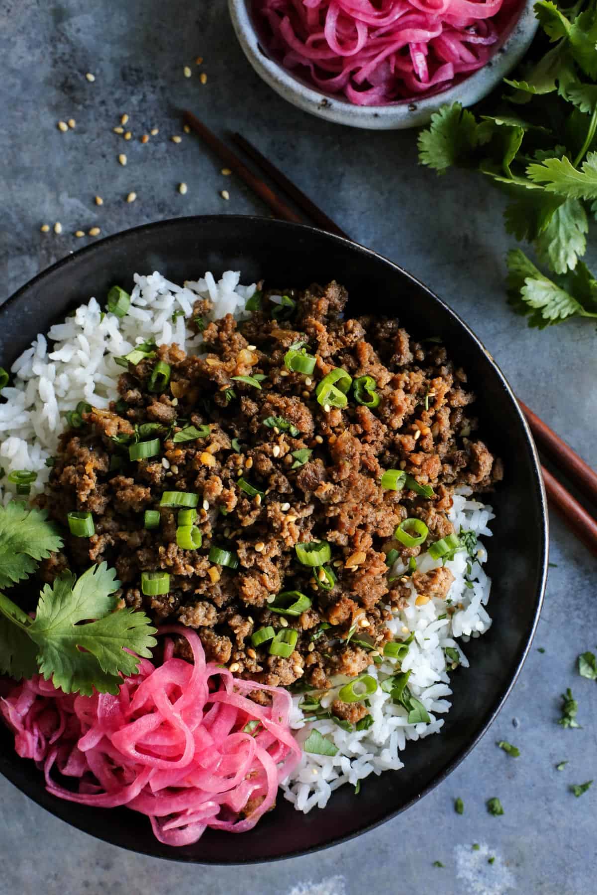 Korean beef over white rice, with pickled red onions