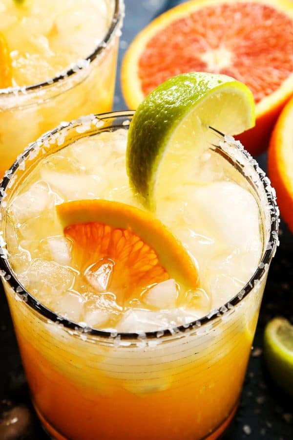 Close-up of an orange margarita in a salt-rimmed glass