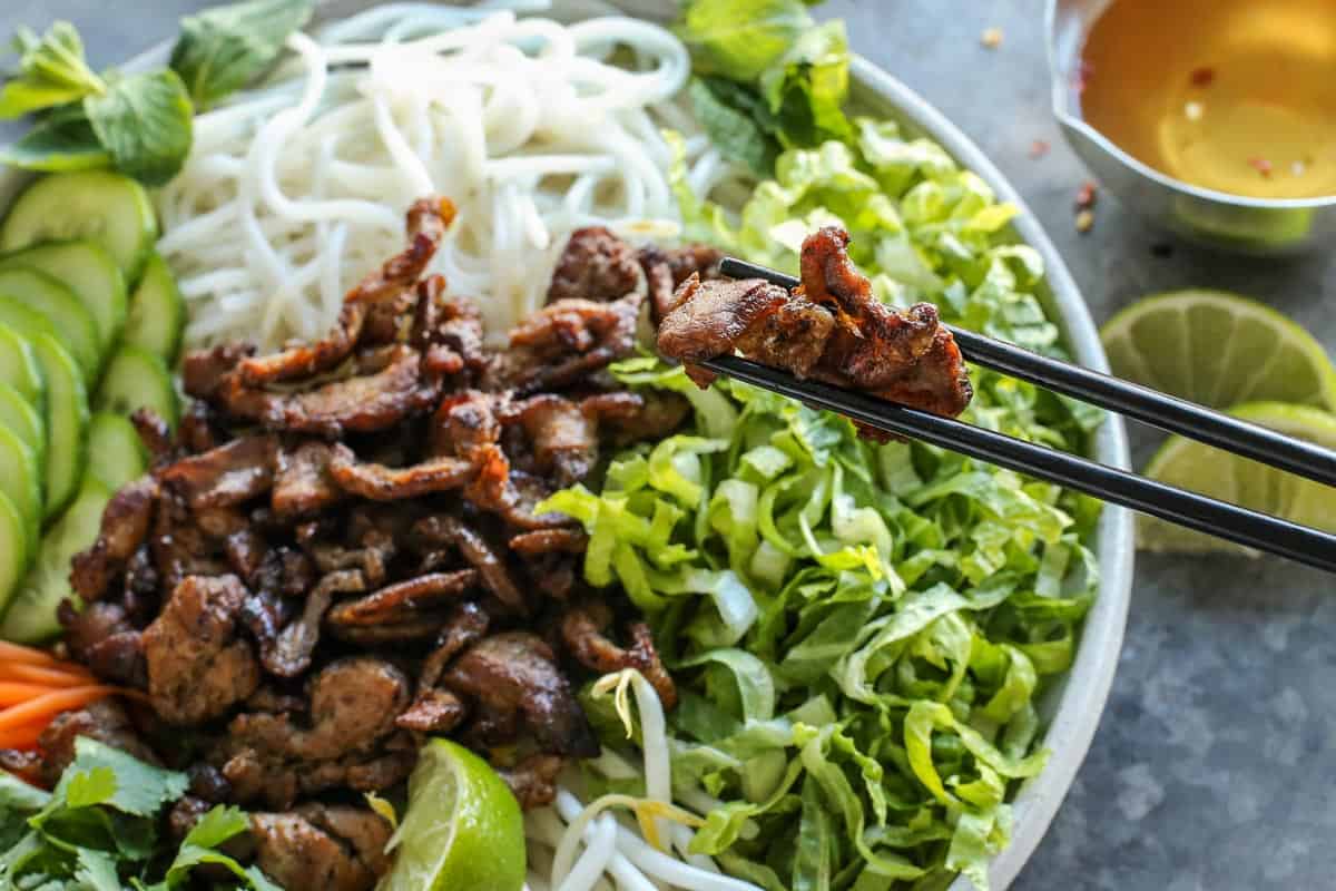 a bowl of Vietnamese Noodle Salad with Pork with chopsticks