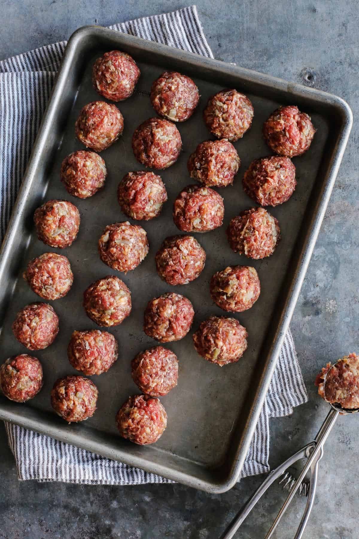 pan of uncooked meatballs 