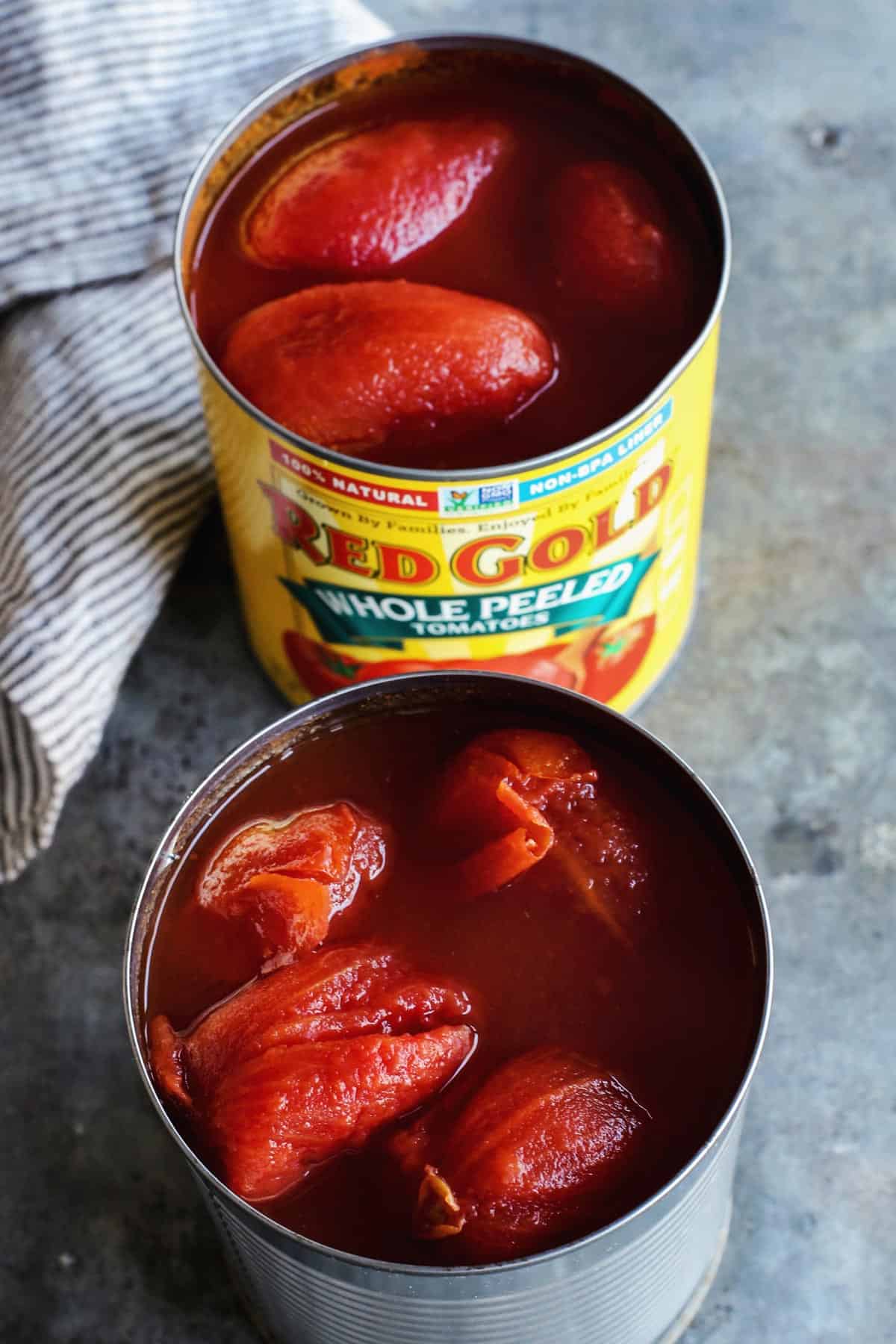 two open cans of Red Gold tomatoes