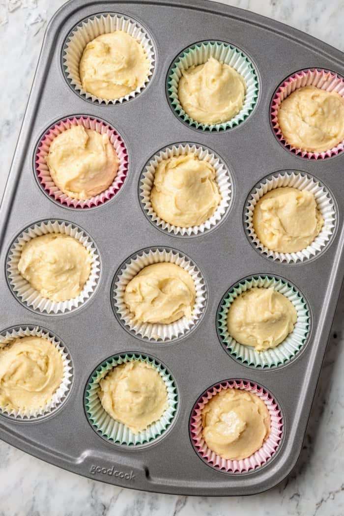 Overhead view of coconut cupcake batter in pan
