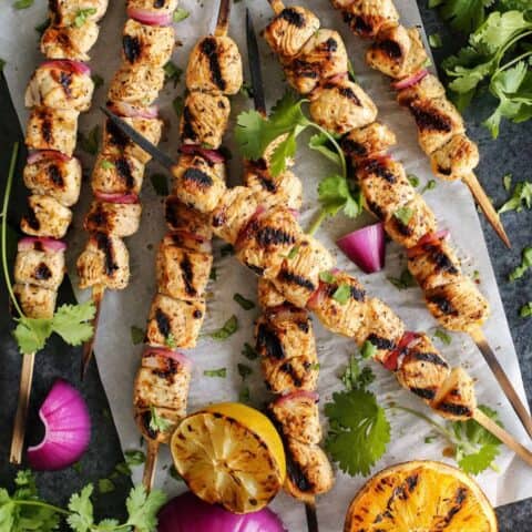 turkey skewers and grilled orange halves