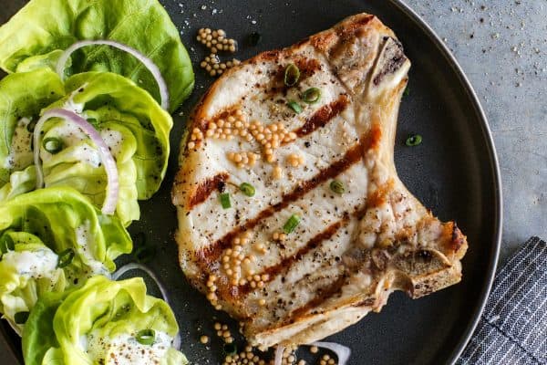 grilled pork chop with a salad