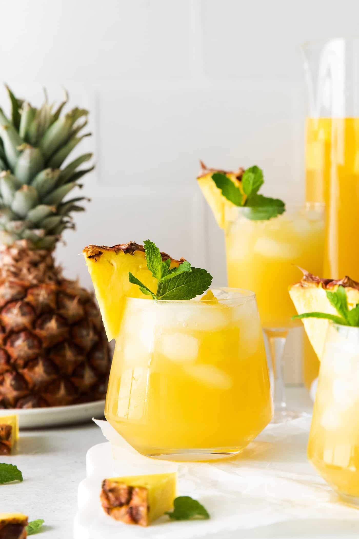 Angled view of pineapple sangria with bourbon in glasses