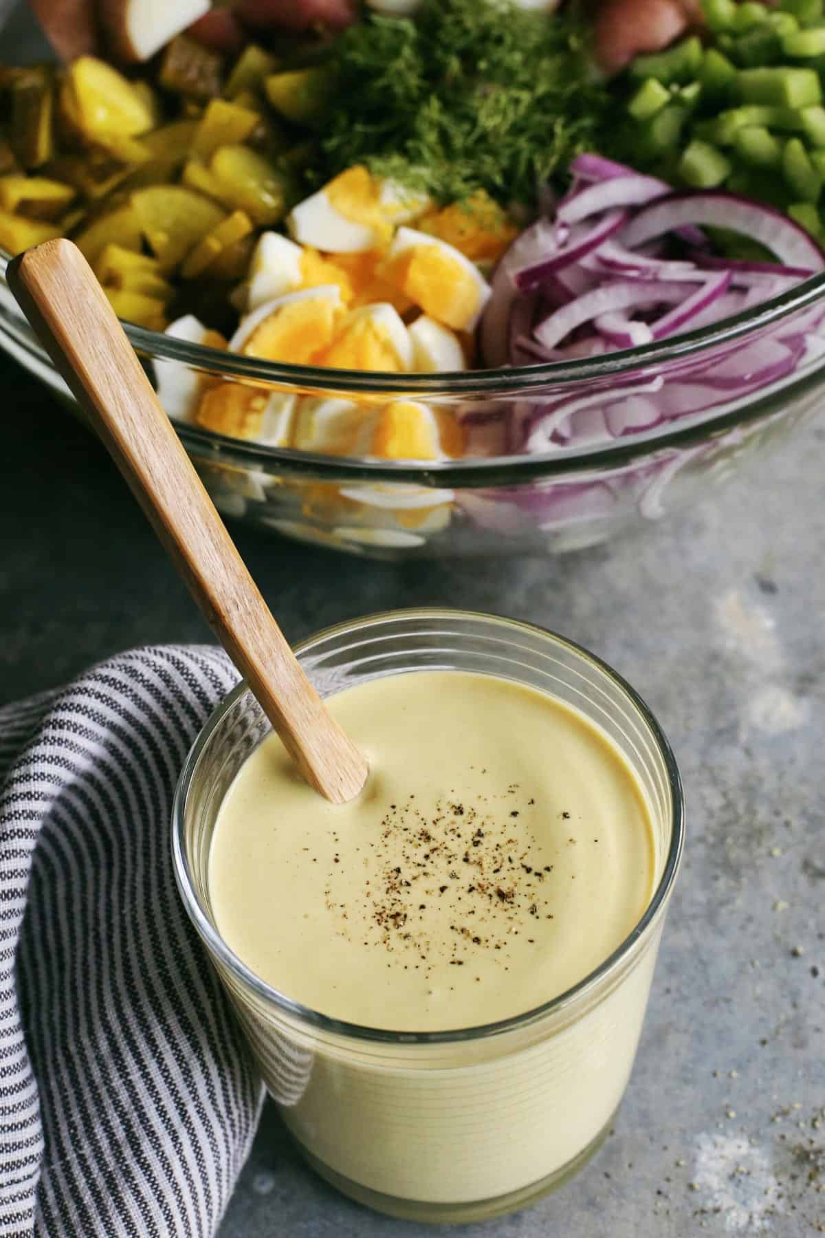 A jar of creamy mustard dressing. 