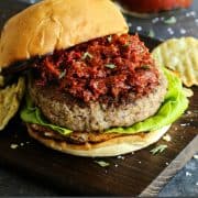 pinterest image of Goat Cheese Stuffed Turkey Burger on a wood board