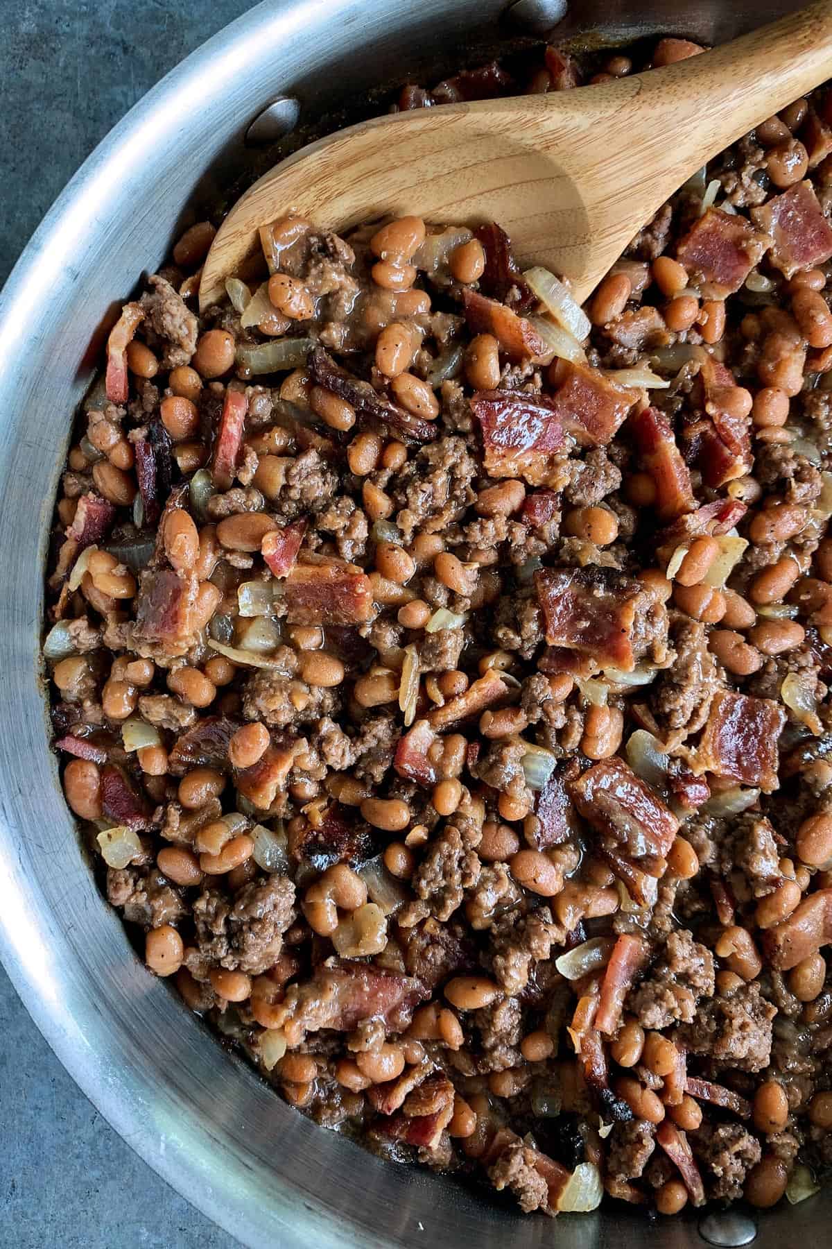 skillet of cowboy beans with bacon and ground beef