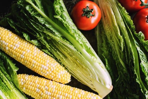 grilled romaine salad has romaine lettuce, tomatoes, and sweet corn