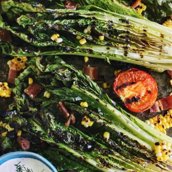 grilled lettuce salad with toppings and ranch dressing