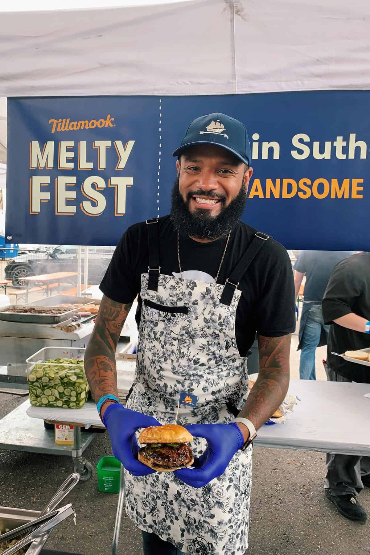 Chef Justin Sutherland holding his version of the Juicy Lucy burger