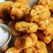 fried pickles on tray with ranch dip
