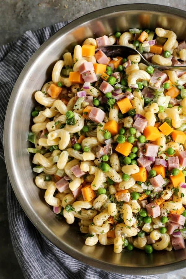 creamy macaroni salad with ham, cheese, and peas