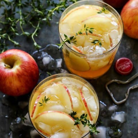 Sangria with apple cider in ice-filled glasses.