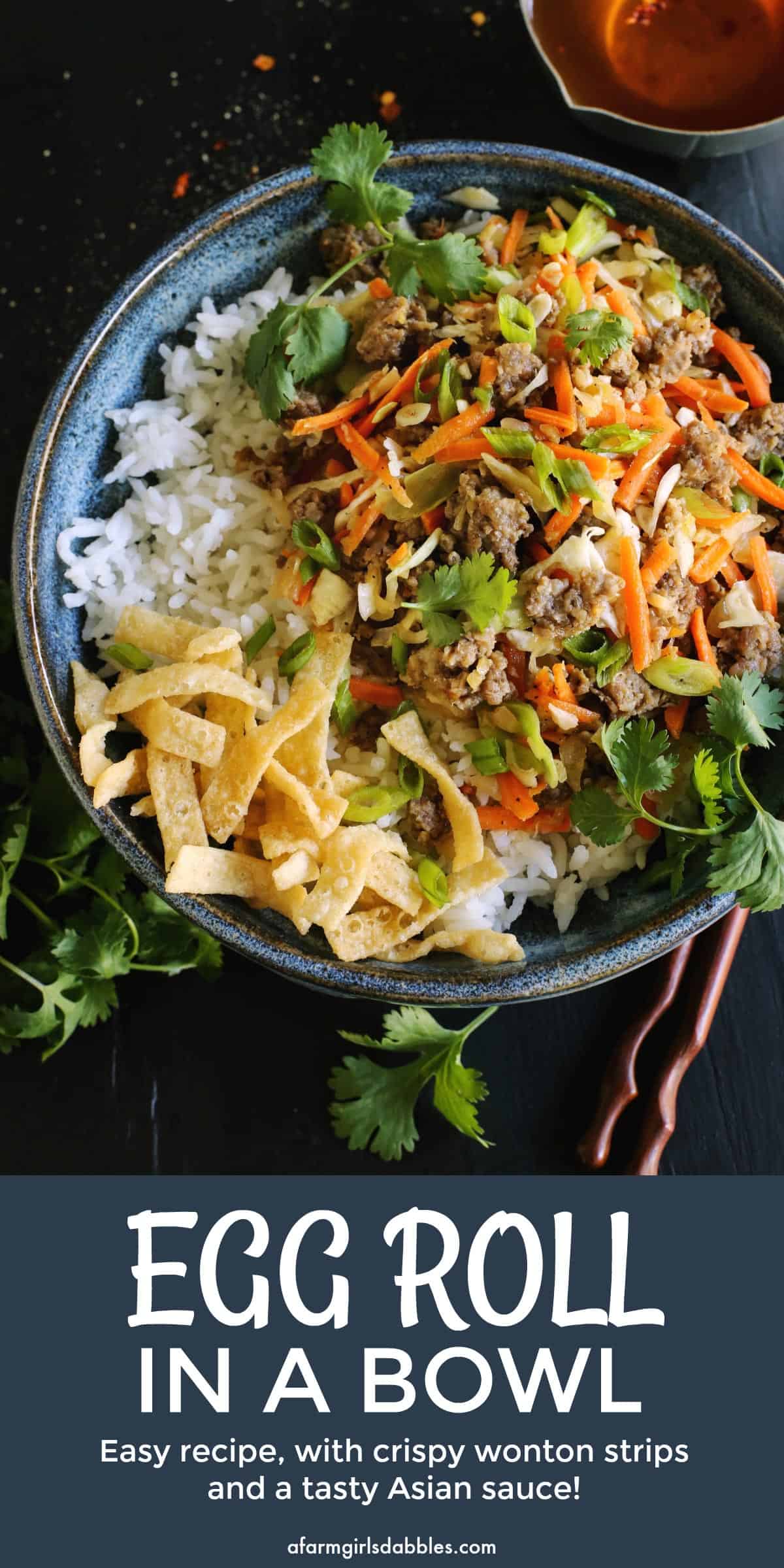 pinterest image of egg roll flavors of ground pork, cabbage, and carrots served in a bowl over white rice