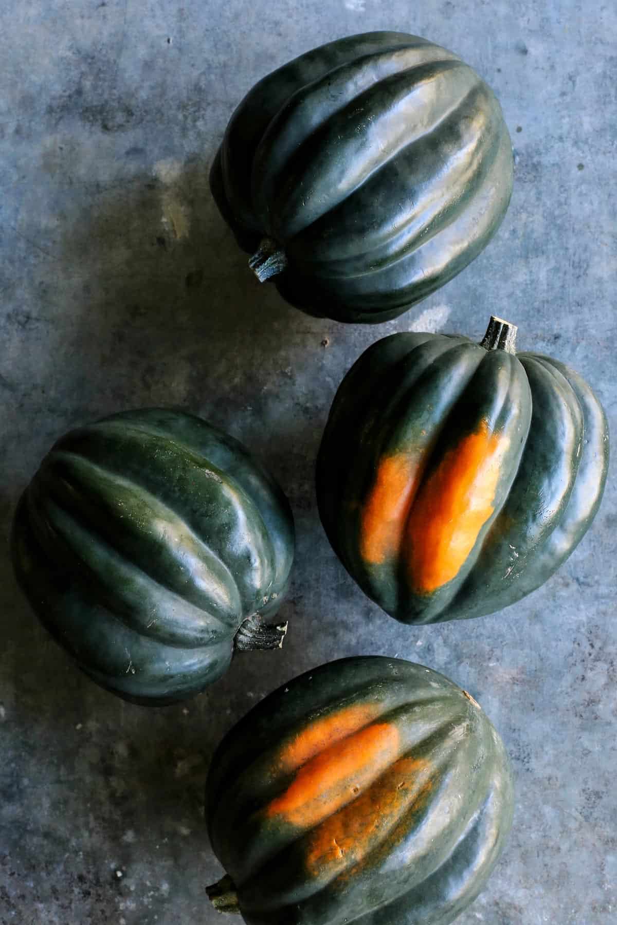 four whole acorn squash