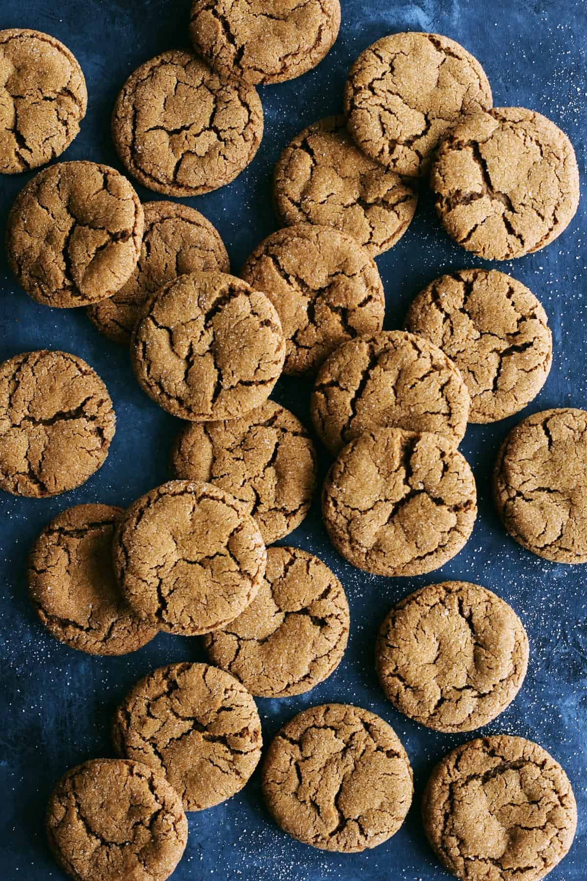 ginger molasses cookies on a dark blue background