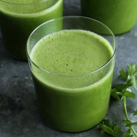 glasses of green juice, plus fresh parsley
