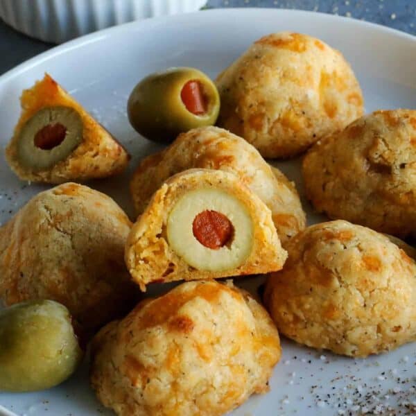 baked olive cheese balls on a plate