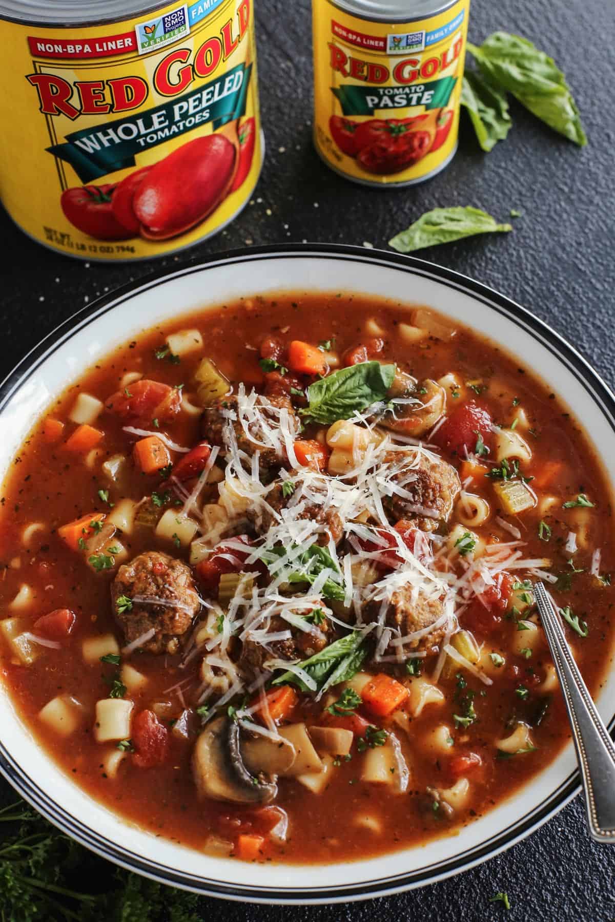 meatball soup with a can of whole peeled tomatoes and a can of tomato paste