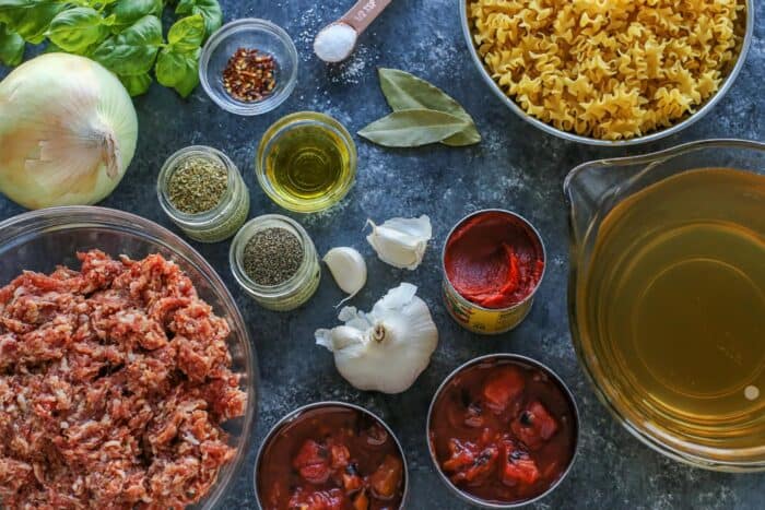 Olive oil, sausage, onion, garlic, pasta and other ingredients.