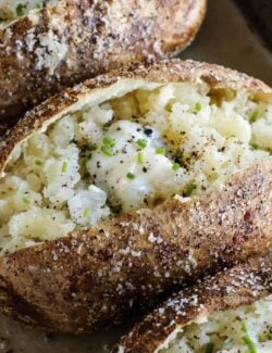 baked potato cut open, with crispy skin and tender insides