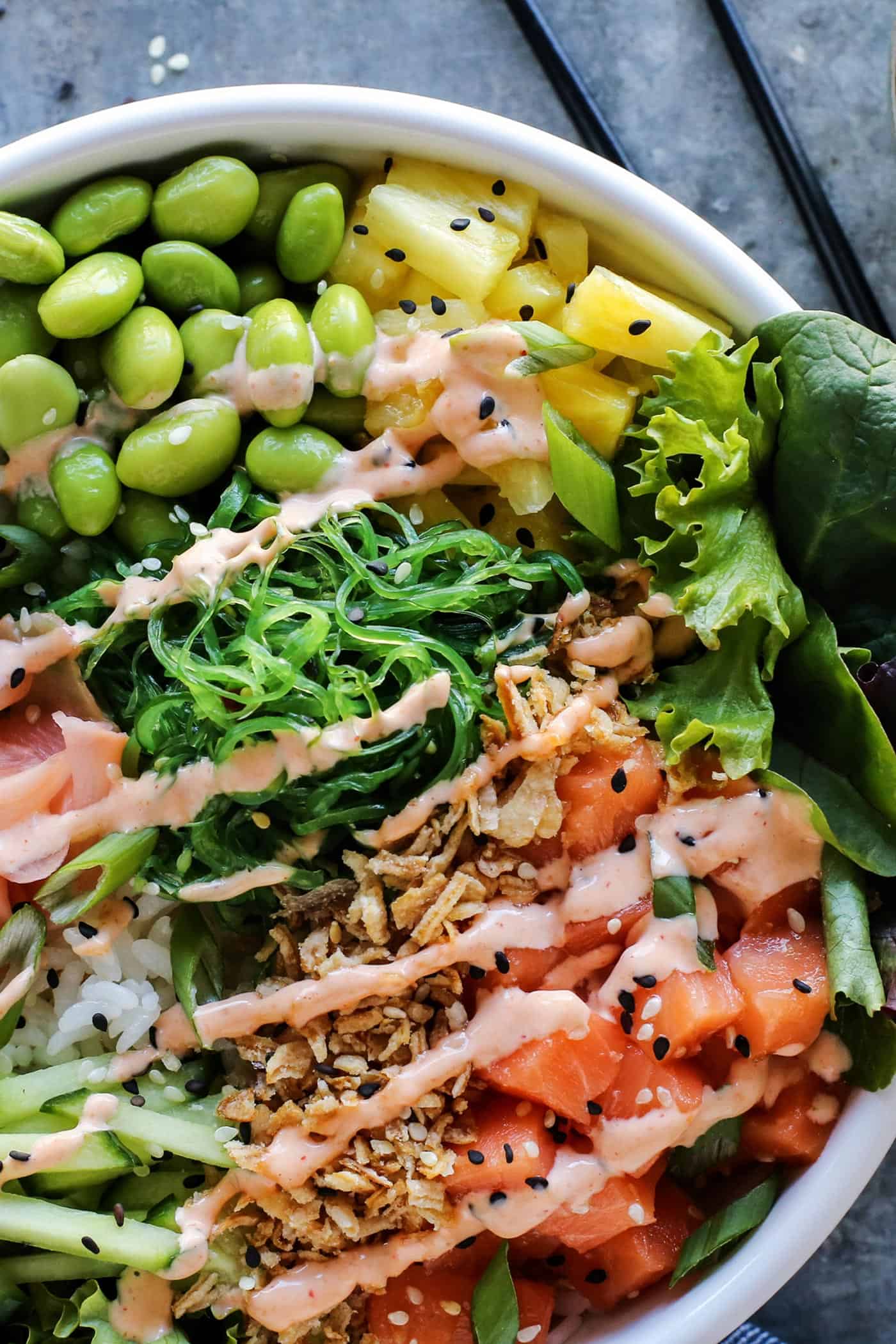 poke in a white bowl with salmon