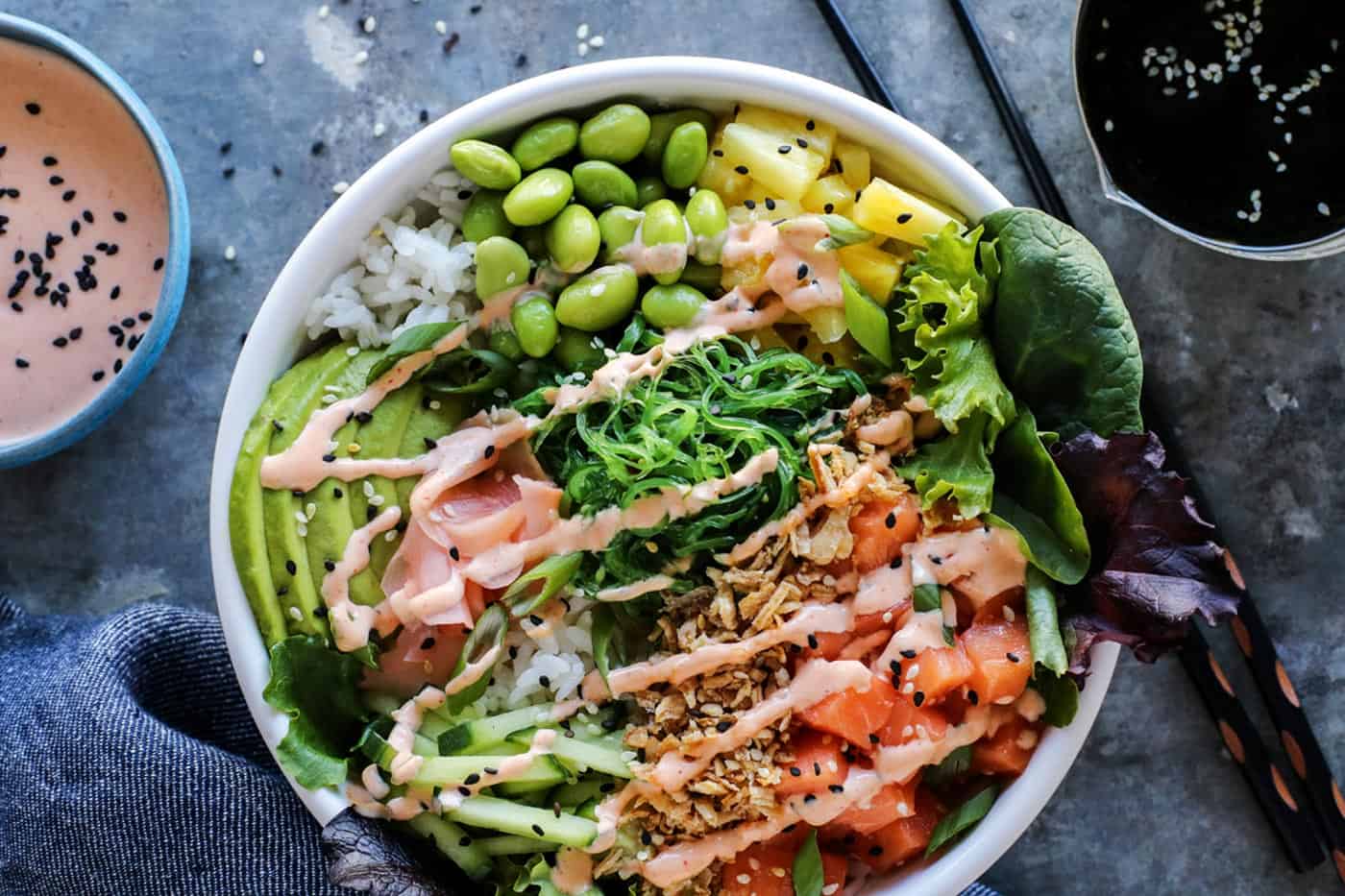 A white bowl filled with homemade poke bowl ingredients