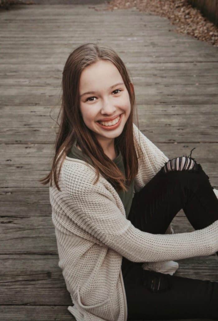 photo of girl on a bridge