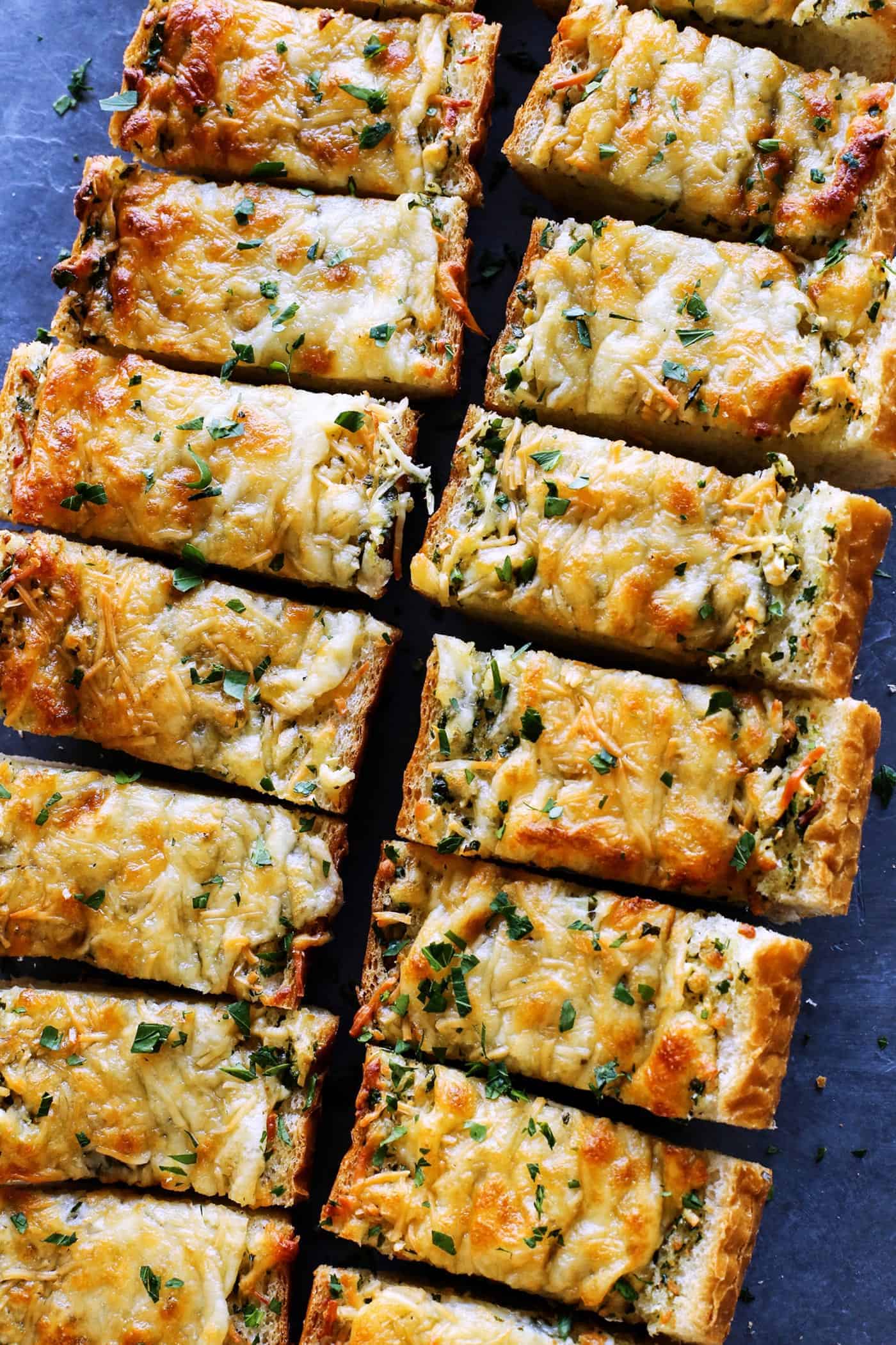 buttery, cheesy garlic bread cut into pieces