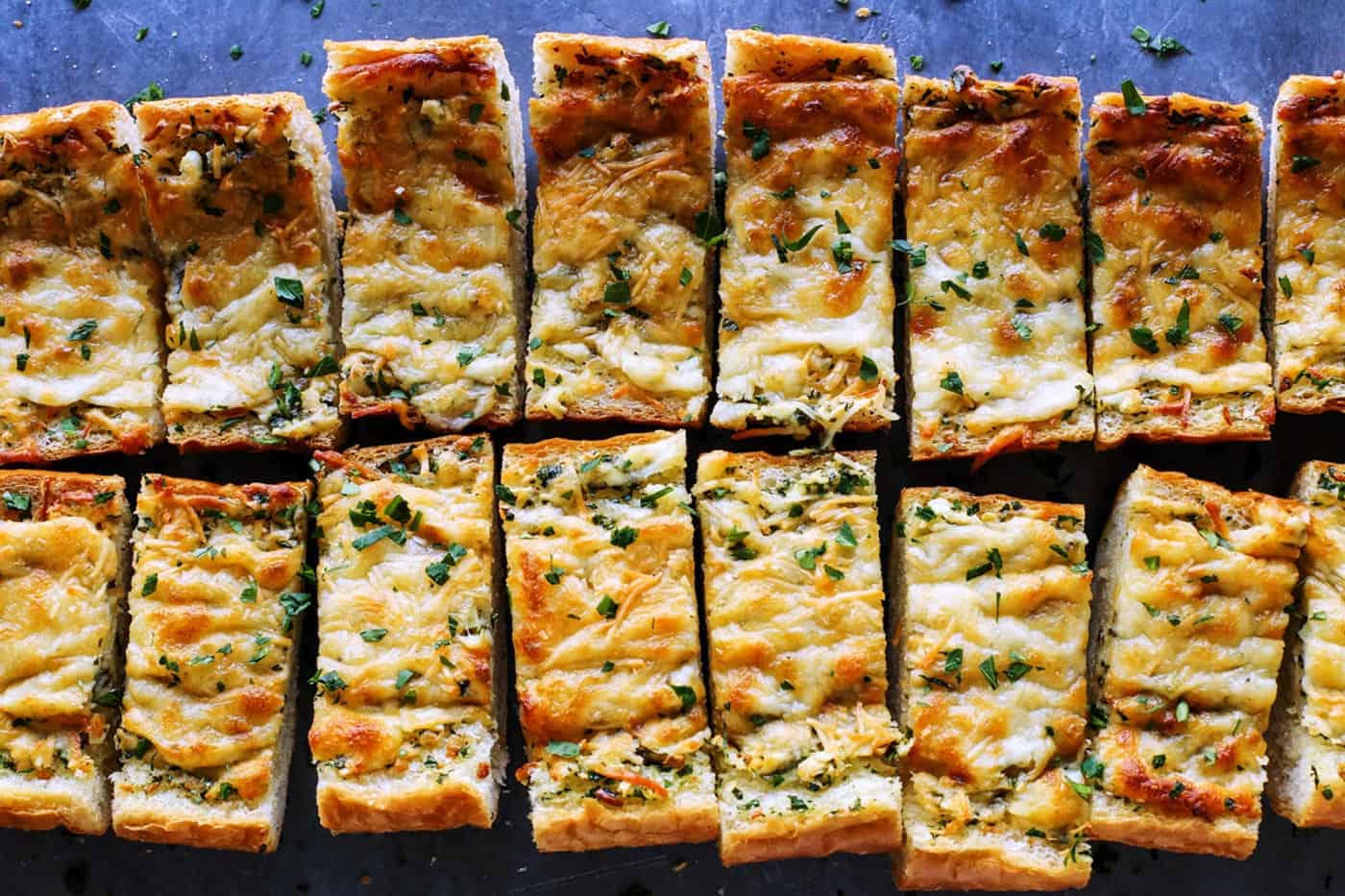 cheesy garlic bread cut into pieces