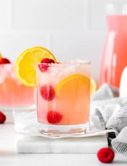 A pink lemonade margarita in a short glass